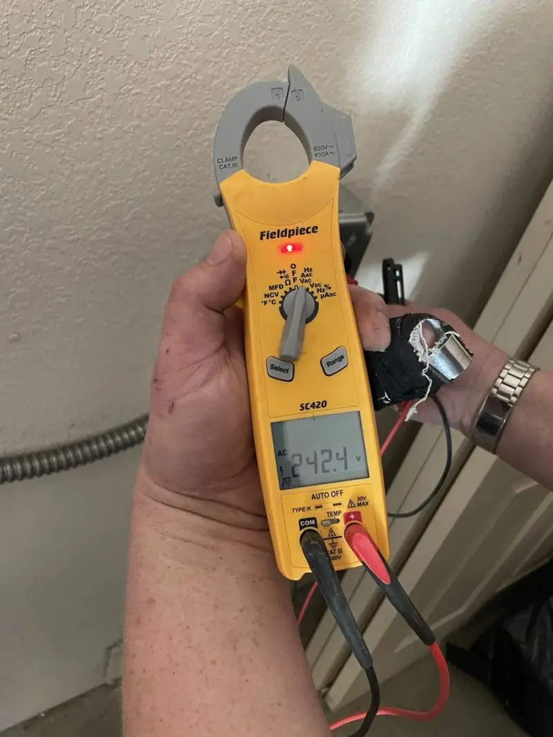 Voltage testing with clamp meter during Electrical Installation Services in Somerset